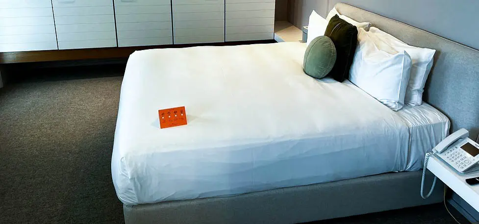 Modern guest room at The Prince Hotel St Kilda featuring stylish decor, a comfortable bed, and large windows with natural light.